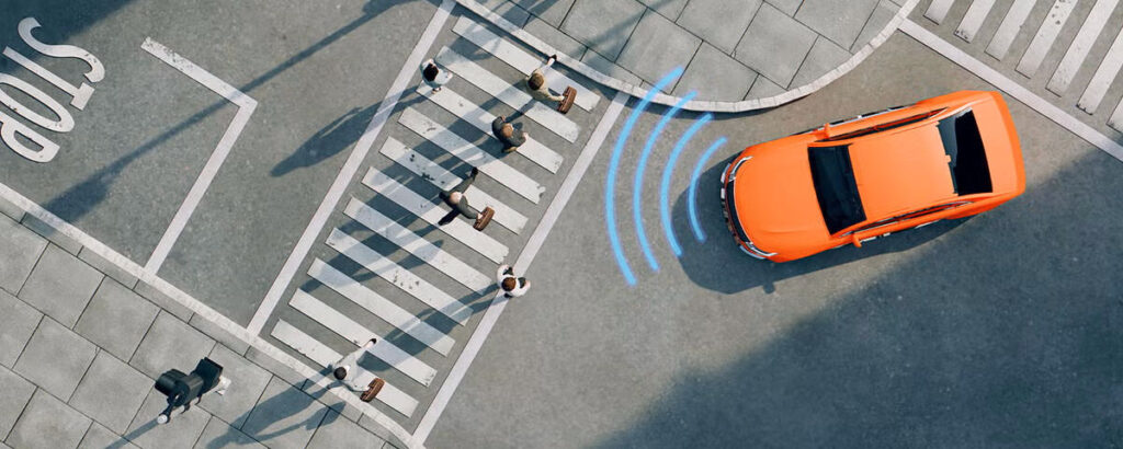 Ariel view of an orange car on a street